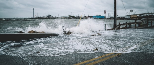 Water crashing over bridge during Hurricane